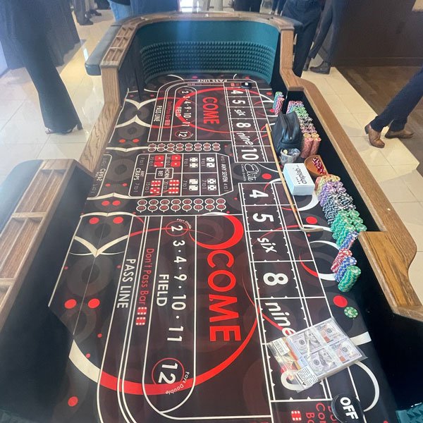 Casino table in Dallas, TX, featuring colorful chips and dice ready for a game
