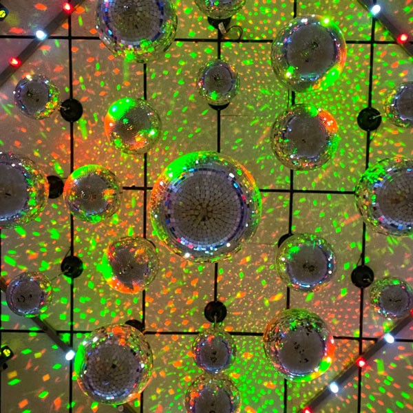 A ceiling adorned with colorful balls, enhancing the uplighting ambiance in Dallas, TX