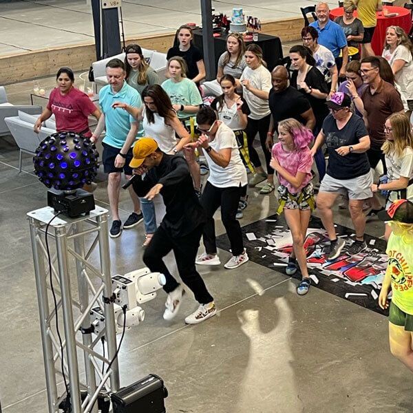 Line Dancing Instruction event with a group practicing synchronized steps indoors in Dallas, TX