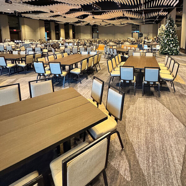 Stylish Event Table Rentals set up for a Christmas party in a spacious room in Dallas, TX