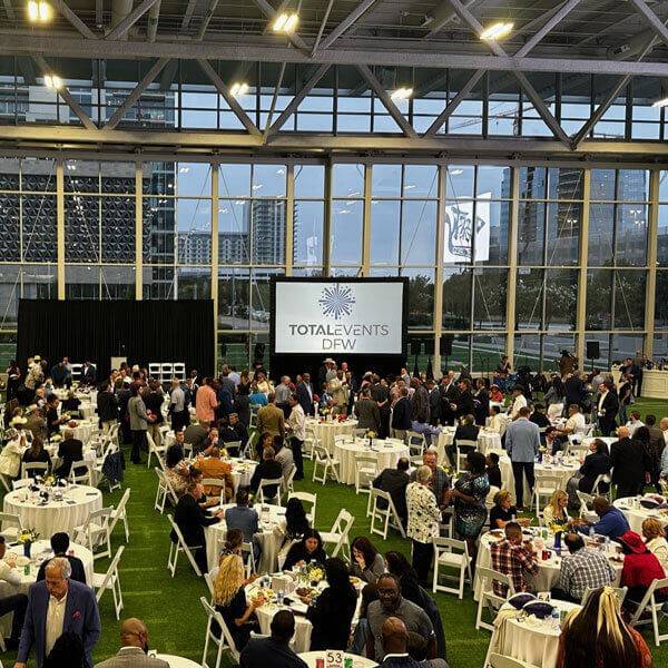 Guests gathered for a large banquet and networking event at a Dallas, TX venue